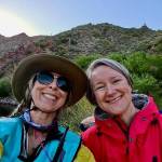 Heidi Skrzypek (left, support kayaker) and Mary Singer (right, swimmer) smile for the camera at Apache Lake (Heidi Skrzypek photo).