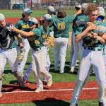 The Vashon Pirates celebrate raucously after a fastball from Will Frith and a catch by Jack Harvey seals their ticket to the 1A State Baseball Tournament (Connon Price Photo).