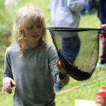 Alex Bruell photo
Griffin Simmons, 7, appreciates the trout he just caught at the fishing derby.