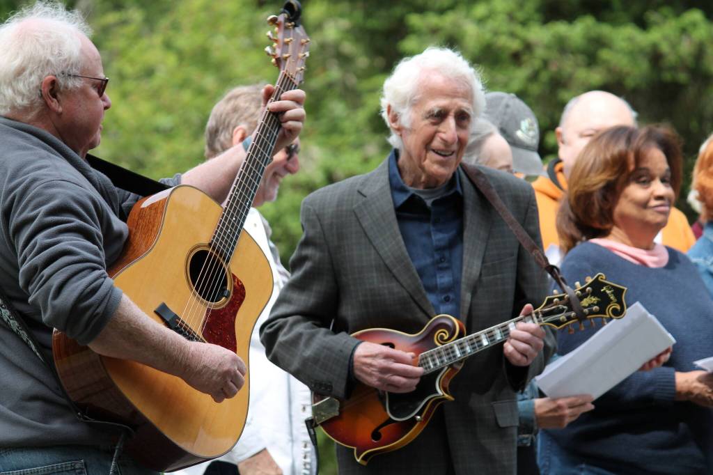 Tom Hughes Photo
Guitarist Mark Wells and mandolinist Paul Colwell play with the Judd Creek Gospel Singers.