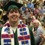 A student smiles during the graduation ceremony at Vashon High School. (Alex Bruell photo)