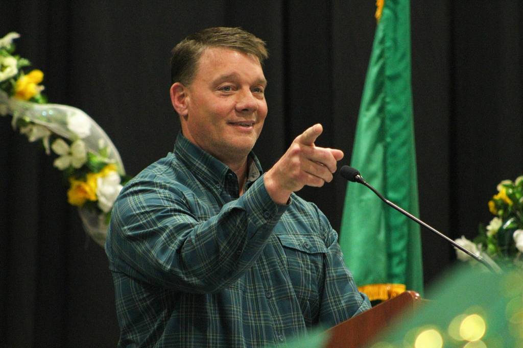 VHS Social Studies teacher Jason Butler bestowed the Pieces of Eight Awards on the class of 2024 during the graduation ceremony June 14. (Alex Bruell photo.)<strong></strong>