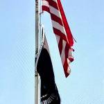 This tattered flag flew at the Vashon post office before being replaced (Photo by Tag Gornall).