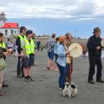 Vashon residents sang a welcome song gifted by Mike Evans, Snohomish elder and skipper of the Blue Heron. (Jim Diers photo.)