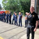 Elizabeth Shepherd Photo
Fire Chief Matt Vinci, with first responders, at a push-in ceremony held at Station 55 on Saturday to celebrate the arrival of two new ambulances on Vashon.