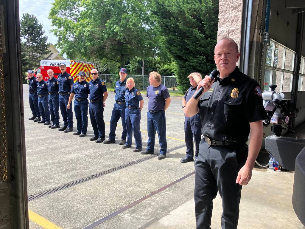 Elizabeth Shepherd Photo
Fire Chief Matt Vinci, with first responders, at a push-in ceremony held at Station 55 on Saturday to celebrate the arrival of two new ambulances on Vashon.