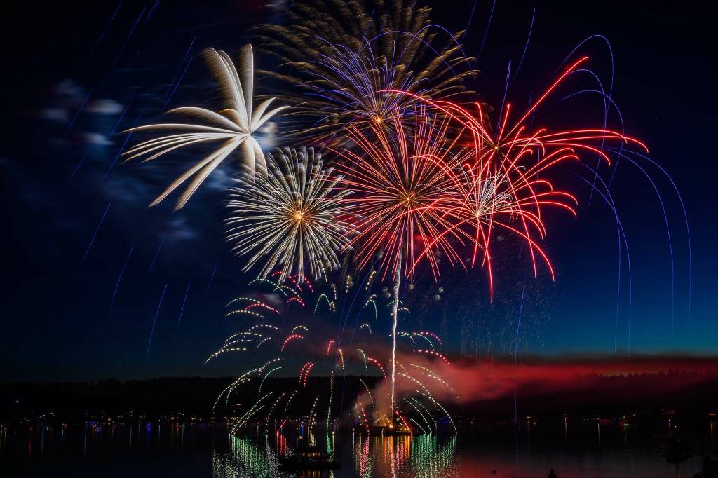 July Fourth fireworks painted both the sky and water of Quartermaster Harbor with brilliant, blooming colors. (John de Groen photo.)