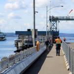 A ferry pulls toward the Fauntleroy ferry dock on a cloud-pocked March afternoon. (Alex Bruell photo.)