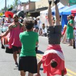 A parade member takes a stand on Saturday. (Alex Bruell photo)