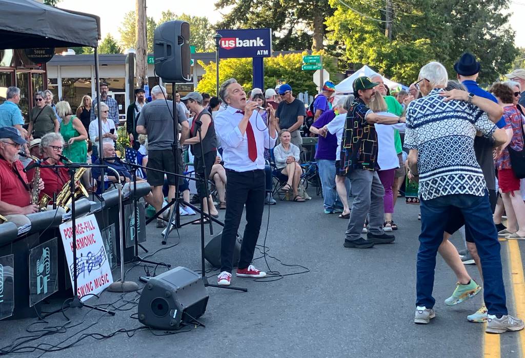 Vashons answer to Frank Sinatra, Lou Mangione, crooned his heart out for the dancing crowd as Portage Fill played its annual street dance. (Elizabeth Shepherd photo)