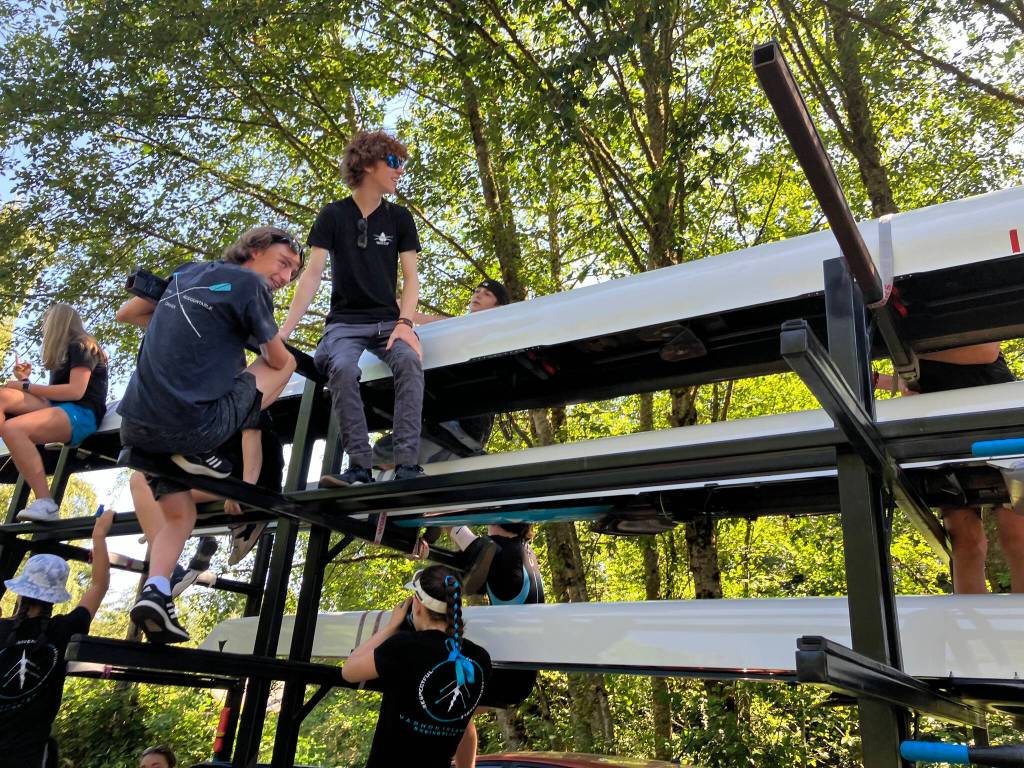 Vashon Island Rowing Club members climbed atop the clubs rowing shell trailer before the parade. (Elizabeth Shepherd photo)