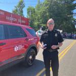 Fire Chief Matt Vinci, in the staging area for the Strawberry Festival parade, beside the fire districts Mobile Integrated Health vehicle. (Elizabeth Shepherd photo)