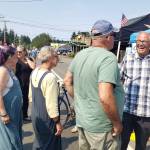 Washington state Governor Jay Inslee mingles with islanders at Strawberry Festival on July 21, 2024. (Leslie Brown photo)