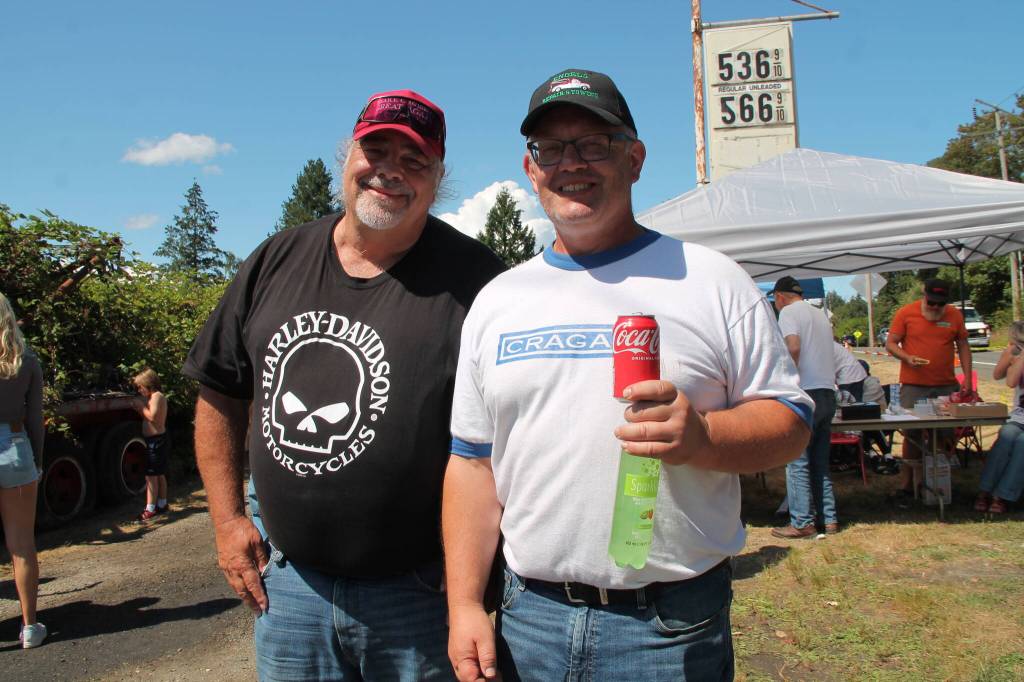 Richard Rollins (left) who completely rebuilt his 1930 Model A Roadster from parts, drove from Rochester, Washington, to the car show  and was warmly welcomed by his old friend, Paul Engels.