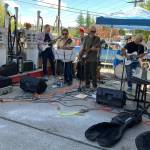 A reconstituted version of the Doiley Brothers rocked the stage set up by the gas stations retro pumps. (Tom Hughes photo)