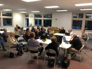 The Vashon Health Care District board (right) discusses a plan to bring urgent care to Vashon Island, with the Vashon Island Fire & Rescue board and members of the public in attendance.