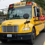 You must stop your vehicle when a school bus looks like this, even if you are in the opposing lane. The lights are flashing red, and the stop-sign arm is extended. (Rick Wallace photo.)