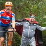 Jim Marsh "encourages" a rider during the Passport2Pain bike ride on Saturday, September 14.