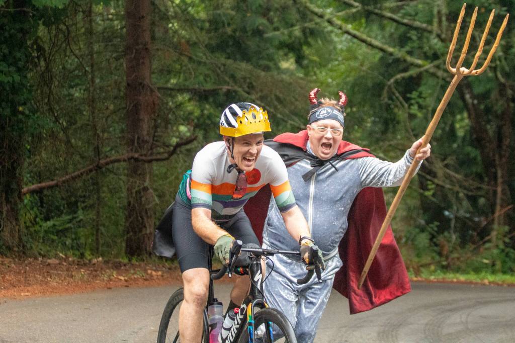 Jim Marsh chases a rider during the Passport2Pain bike ride on Saturday, September 14. (Alex Bruell photo)