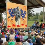 Chautauqua Elementary School students looked up and listened as a mural of Lucy Slagham Gerand was unveiled on the schools playground. (Elizabeth Shepherd photo)