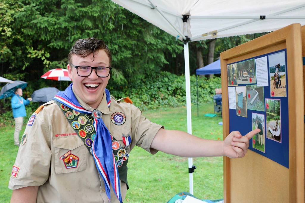 Everett Hatfield, a senior at Vashon High School and Eagle Scout #106, points to his Eagle Scout project  a new aerator installed at the Sportsman Club pond to improve oxygen levels for the fish and enhance the local environment. (Aspen Anderson photo)