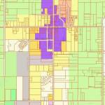 This image shows Vashon zoning, zoomed in on Vashon Rural Town. Areas in green are zoned Rural Area. Areas in dark purple are zoned Community Business. Gray areas are zoned Industrial. Areas in shades of yellow, orange and red are either Residential or Office. The orange-shaded part of town is zoned R-12; all other residential parts of Vashon Town are zoned R-1, R-4 or R-8. (King County iMap screenshot)