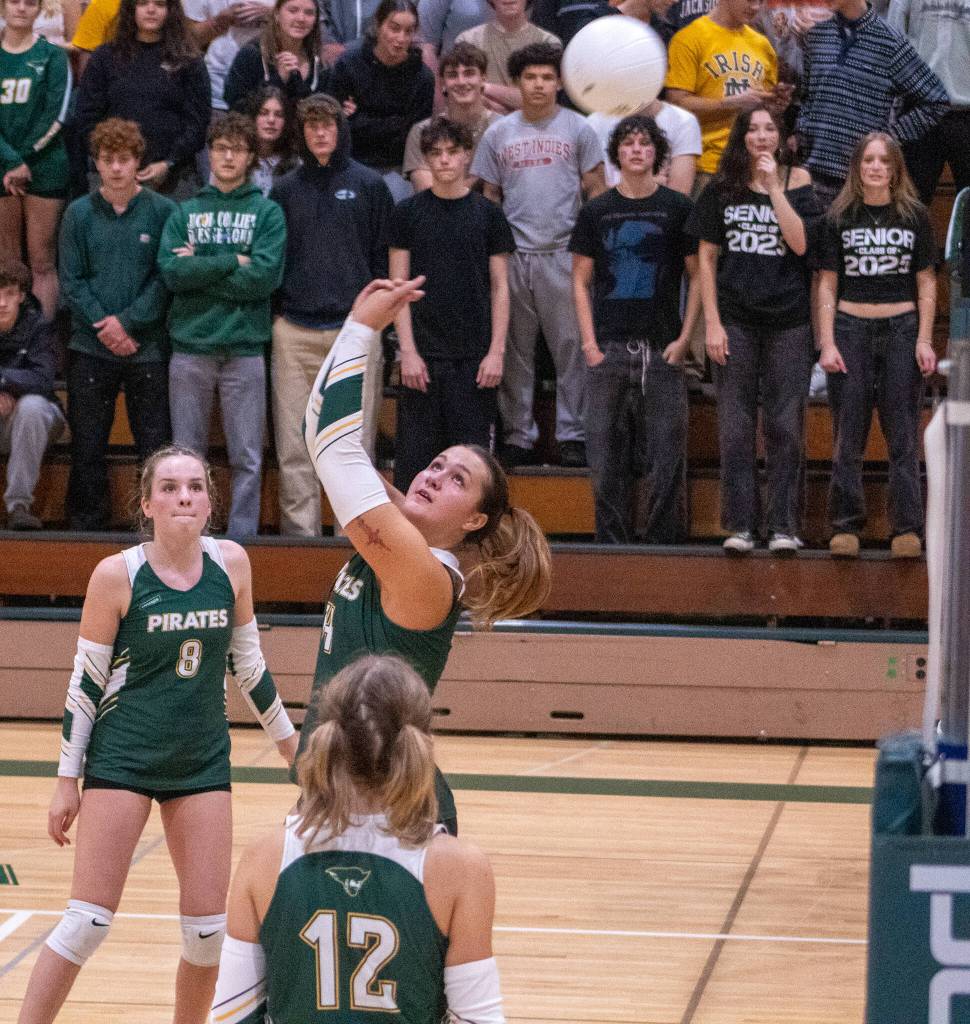On the varsity team, Senior middle hitter #14 Mylie Limont, Freshman outside hitter #8 Ellie Wolcott and Senior Captain Setter #12 Maddie Youman compete against East Jefferson High School at Vashon on September 25. (Alex Bruell photo)