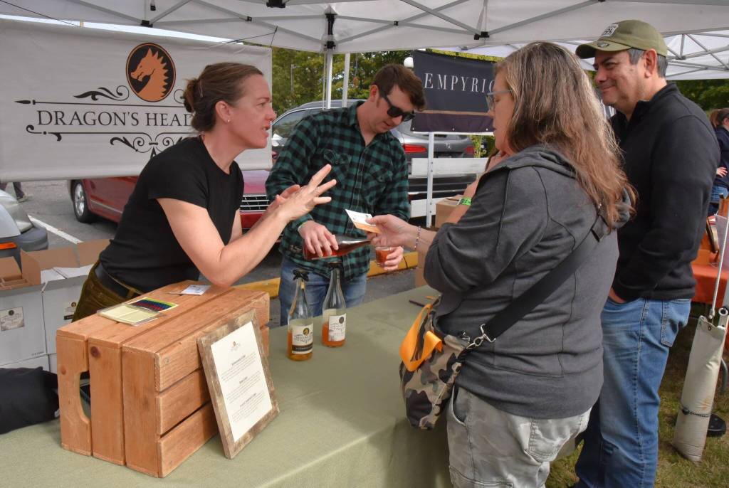 Laura Cherry, of Dragons Head Cider, greets Cider Fest attendees. (Jim Diers photo)