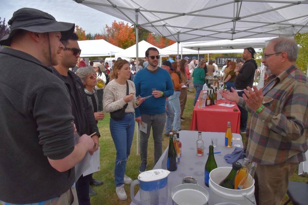 Stephen Buffington, owner of Vashons Shawnee Hill Farm, greeted visitors to his booth at Cider Fest. (Jim Diers photo)
