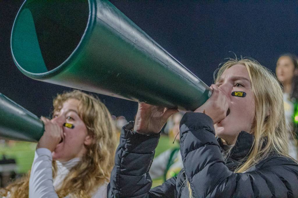 Cheerleaders pump up the crowd. (Alex Bruell photo)