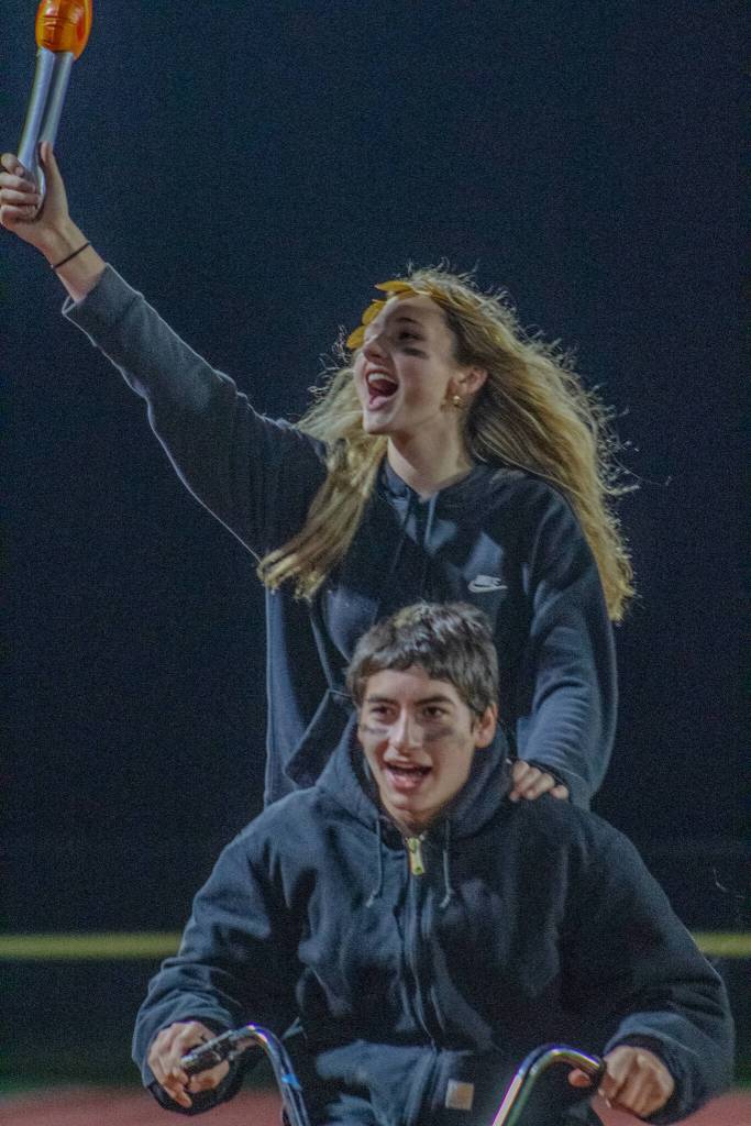 Freshman Class homecoming court honorees Pierce Guenther and Gloria Erickson rode to glory at the halftime crowning ceremony. (Alex Bruell photo)