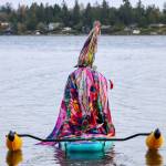 Matt Beursken stands out on the water in a vibrant rainbow witchs hat made of ribbons and a stained-glass-inspired cape. (Aspen Anderson photo)