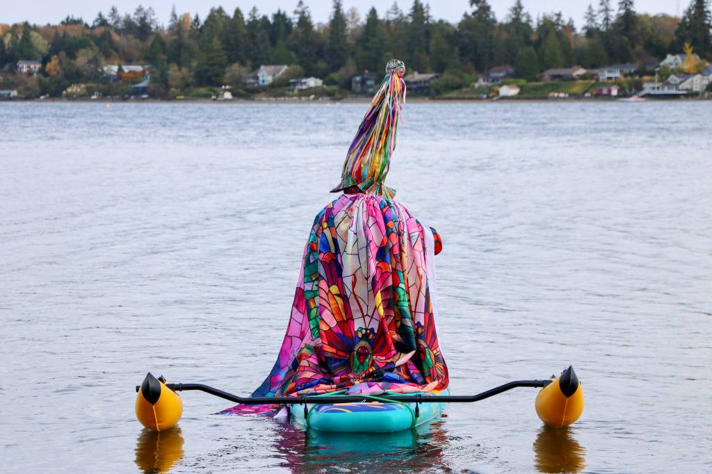 Matt Beursken stands out on the water in a vibrant rainbow witchs hat made of ribbons and a stained-glass-inspired cape. (Aspen Anderson photo)