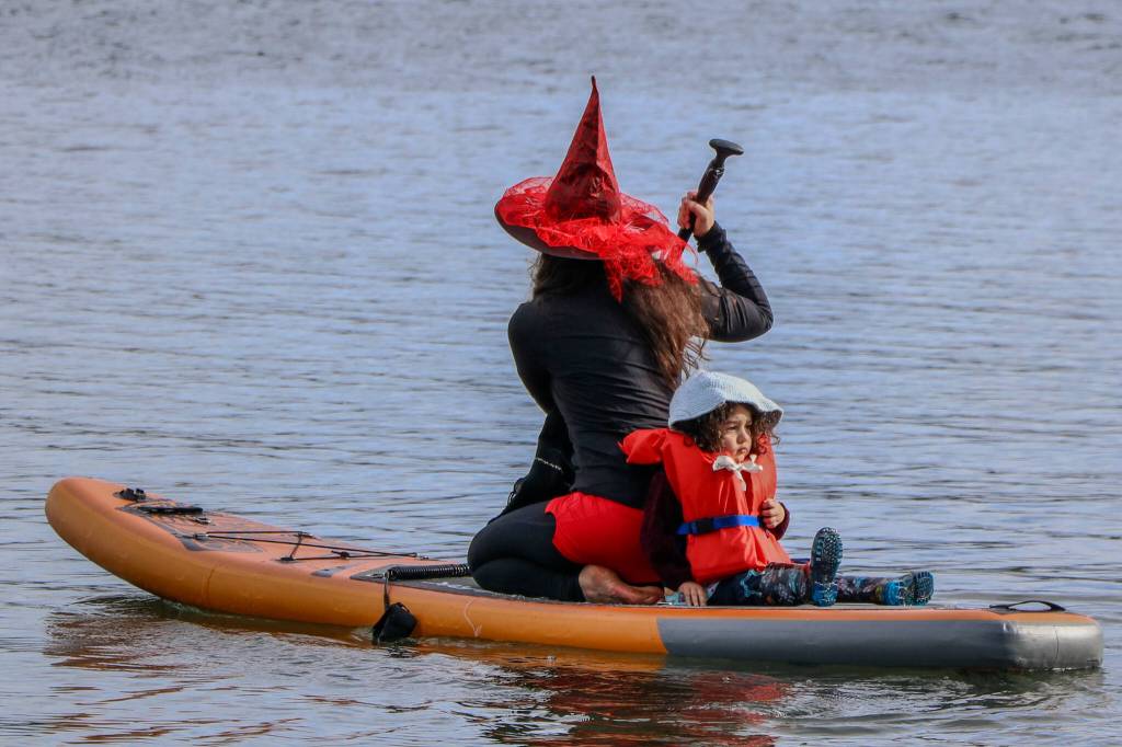 Witches of all ages paddle through the cold waters at Jensen Point. (Aspen Anderson photo)