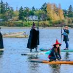 Paddlers decked in their best witch attire bring an annual Halloween tradition to life at Jensen Point, turning the waterway into a scene of spooky, floating fun. (Aspen Anderson photo)