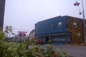 Alex Bruell photo
A car drives through Vashon's four-way stop on a soggy November morning. Vashon's rural town straddles Vashon Highway from roughly Cove Road south to Cemetery Road. Encompassing the core business area of the island, it is the subject of many of the proposals in the current comprehensive plan update process.