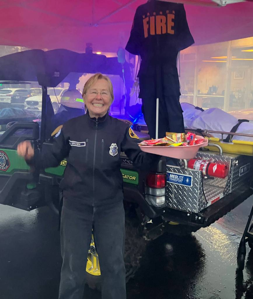 Fire Commissioner and EMT Brigitte Schran Brown passed out sweets and smiles at Vashon Island Fire & Rescues haunted helpers display. (Elizabeth Shepherd photo)