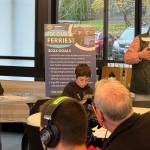 Courtesy photo
Islanders for Ferry Action Director Amy Drayer welcomes participants to the Regional Ferry Summit as Rick Wallace prepares to moderate the first panel discussion.