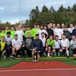 The men and youth of this years Ryan Krug Memorial Cup are pictured after the end of the game. (Cara Briskman photo)
