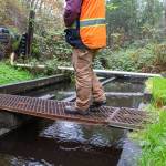 Mckenzie Bomber, Water District 19 operator in training, gives a tour of the districts Beall Creek pump station. (Alex Bruell photo)