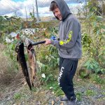 A Vashon youngster prepares to throw chum into the water. (Taylor Umetsu photo)