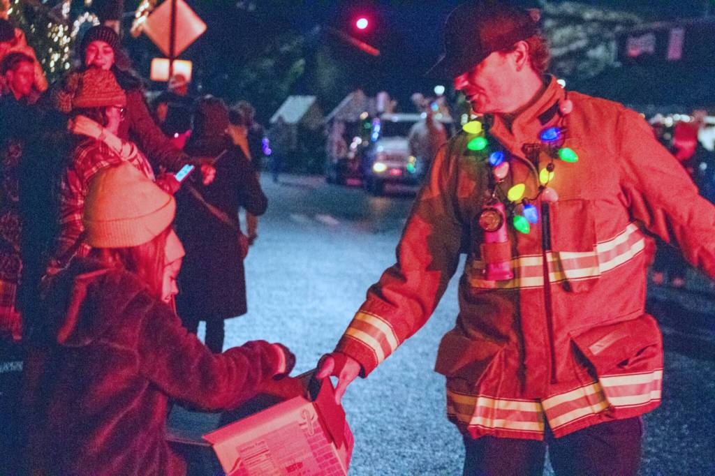Vashon Island Fire & Rescue crews handed out candy and flashed their truck lights on their way through town. (Alex Bruell photo)