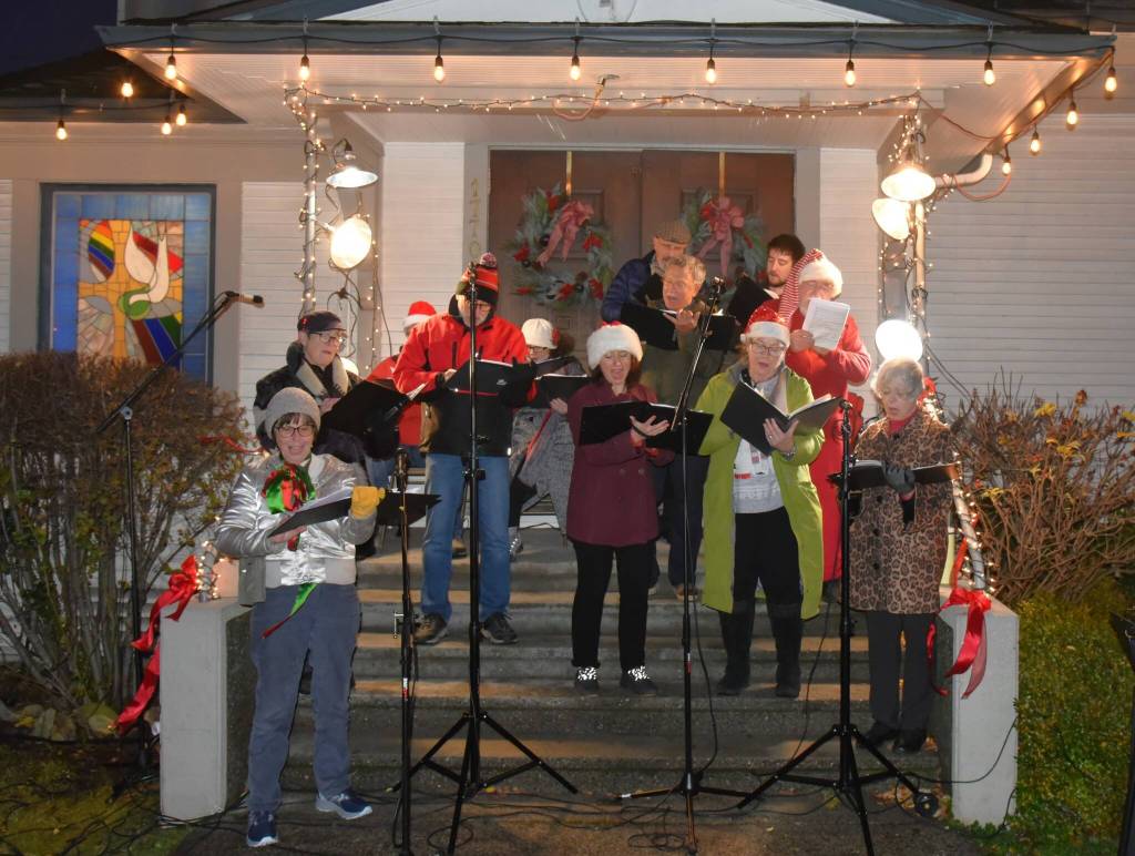 The Vashon Island Chorale performs on the steps of the Presbyterian church. (Jim Diers photo)