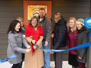 The ribbon is cut at Island Center Homes by, from left to right: Kelly Rider, director of the King County Department of Community and Human Services; Judy Tucker, owner of Form + Function Architecture; Kari Dohn Decker, interim executive director of Vashon HouseHold; Alex Crowder, CEO of Crowder Construction; Chris Lovings, community engagement lead at the Washington State Department of Commerce; Rachel Hetrick, housing stewardship manager at Vashon HouseHold; and Shelly Whitlock, property manager at Vashon HouseHold.
(John Decker photo)