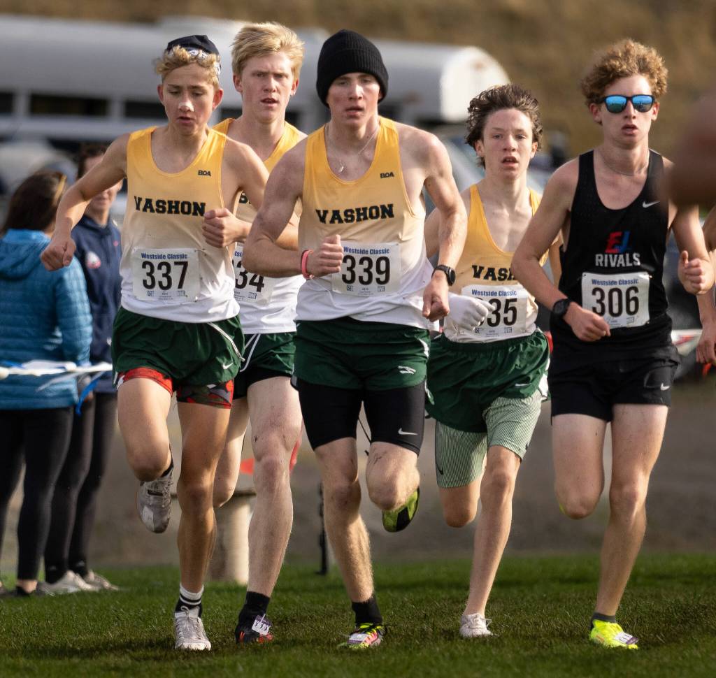 The Vashon Island boys cross country team takes off from the starting line in this photo from the district championship race. (John Decker photo)