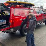 Matt Vinci shows Vashon fire district stalwart Mike Kirk  who has served the district in varying capacities for almost 60 years  the features of the districts new rescue and support rig. (Elizabeth Shepherd photo)