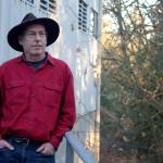 Water District 19 commission board president Seth Zuckerman poses for a photo outside the districts treatment plant on Beall Road and Bank Road. In light of the Palisades Fire, the commission wants to ensure that District 19, the largest purveyor of water on Vashon, has access to enough water should the island face a large fire, and it has requested a fire resilience assessment from the King Conservation District. (Alex Bruell photo.)