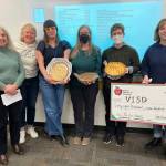 Courtesy photo
From left to right: Karen Boyle, PIE Board President; Juniper Rogneby, Vashon School Board Chair; Kathleen Lawrence, CES Teacher-Librarian and Robotics Teacher; Kate Dunagan, VHS Jewelry Teacher; Kathleen Regovich, VHS Chemistry Teacher; and Jenna Riggs, PIE Board Member stand for a picture with PIE's big check. Not pictured: Award winner Sarah Filanoski, McMurray Humanities Teacher.