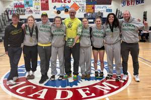 Amy Nielsen photo
The VHS girls team and coaches pose with the Nisqually league championship plaque. Left to right: Per-Lars Blomgren, Hazel Nielsen, Anders Blomgren, Lena Puz, girls coach Jan Nielsen, Sydney Shannon, Kyla Scheff, Alara Demir, and girls coach Stephenen Murphy. Not pictured: Ashley Rice.