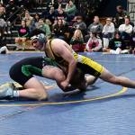 Jair Valle (on top) wrestles on the mat. (Tony Puz photo)